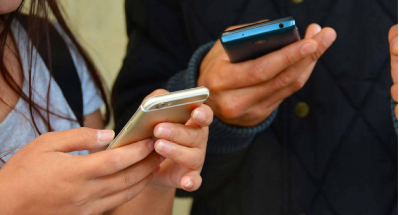 File photo of people using cellphones