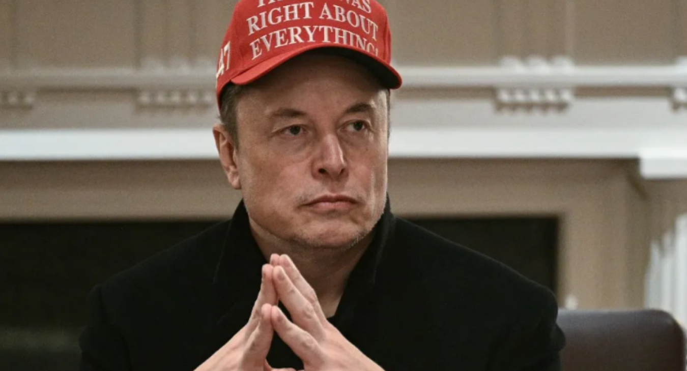 Elon Musk looks on during a cabinet meeting hosted by  Trump