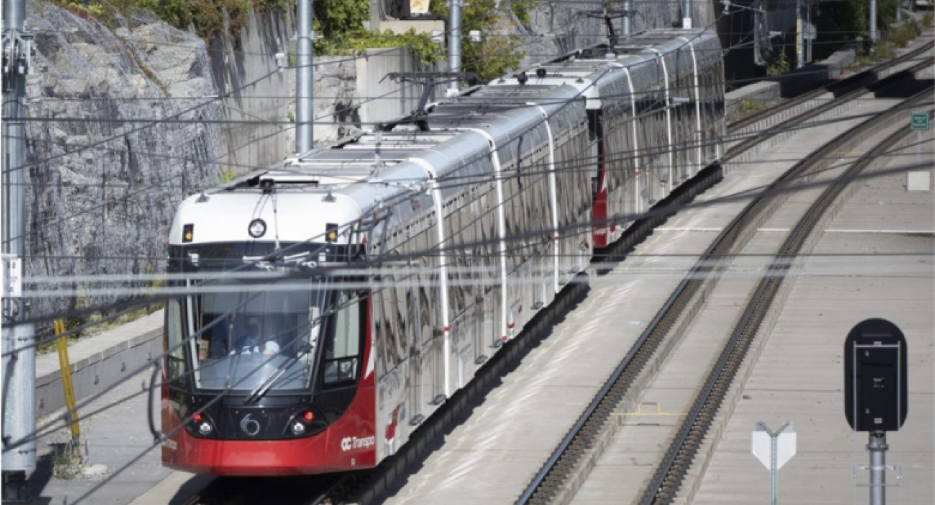 An OC Transpo Light rail transit (LRT) train arrives at the Tunney's Pasture station