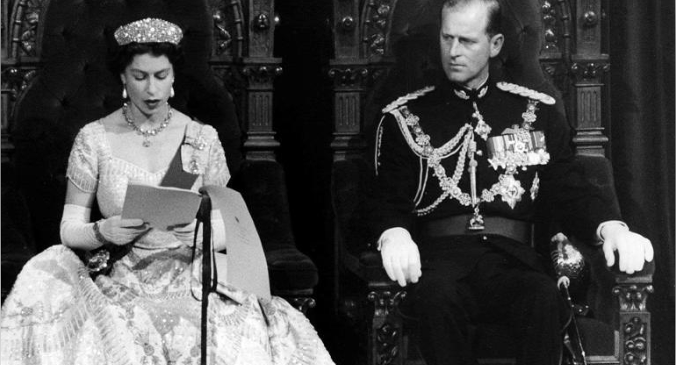 Prince Philip listens attentively as the Queen reads the Speech from the Throne opening Parliament Oct. 14, 195