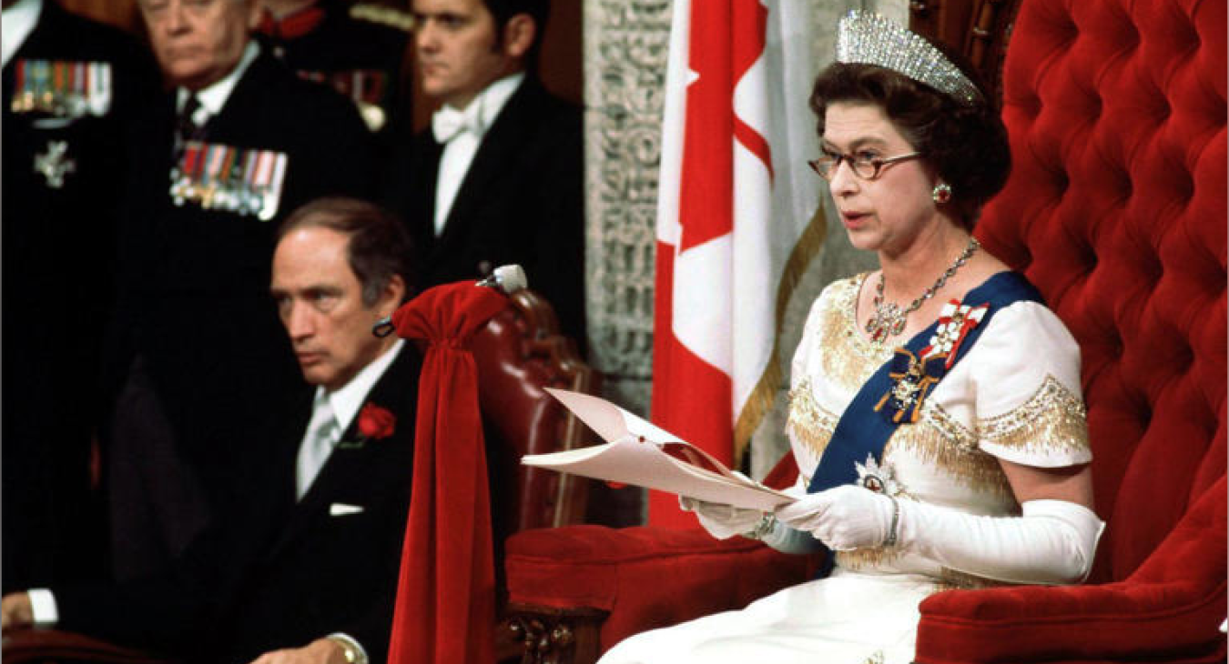 Queen Elizabeth II reads the Throne Speech in the Senate Chambers Oct. 18, 1977, officially opening the session of Parliament. Prime Minister Trudeau sits to the right of the Queen